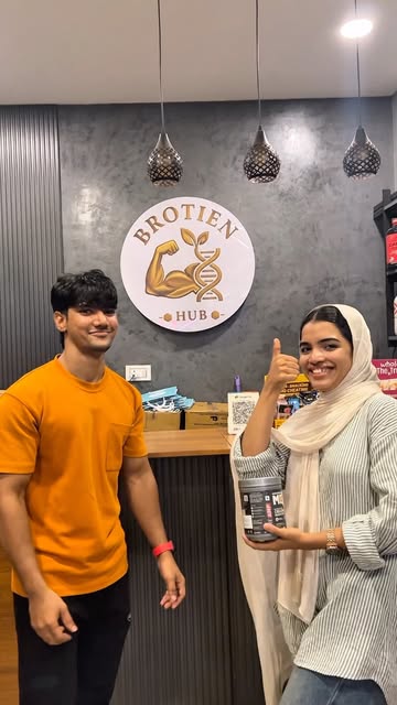 Inside Brotein Hub in Manjeri, the counter, wall logo and customers
