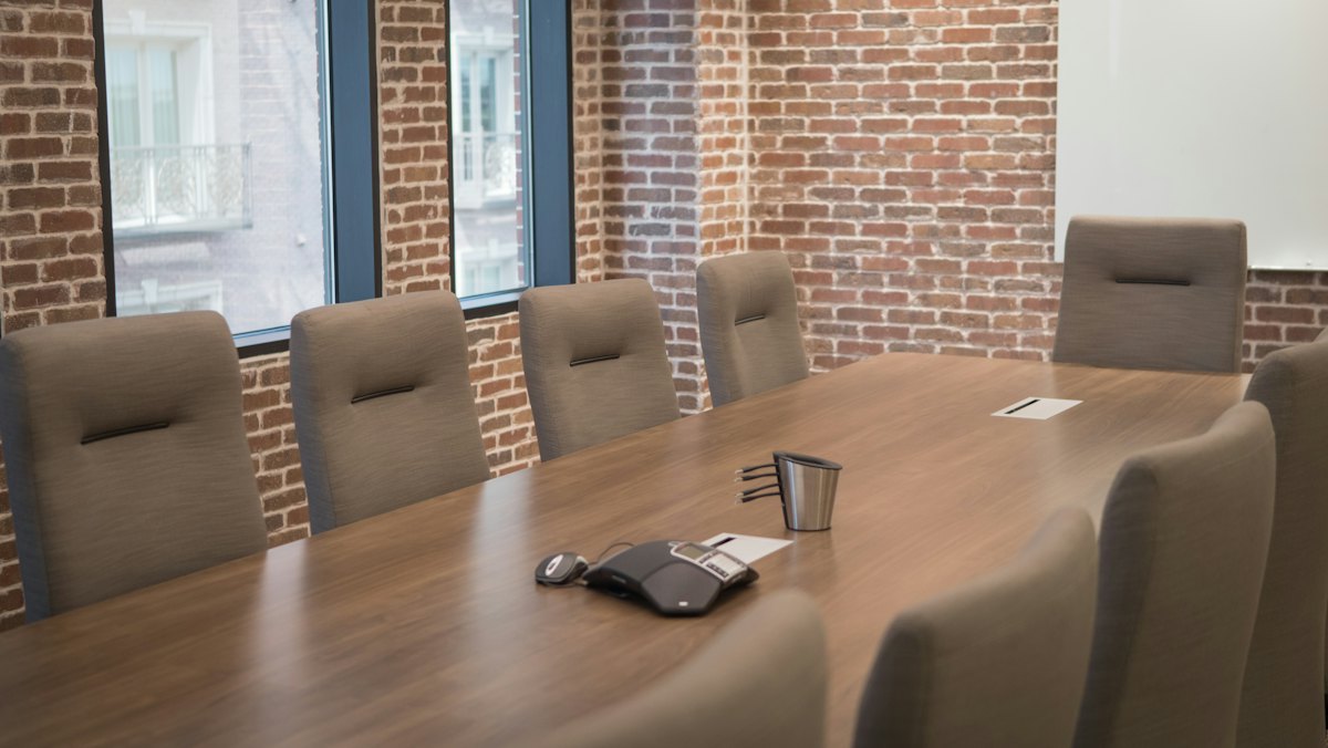 A boardroom table set for a meeting