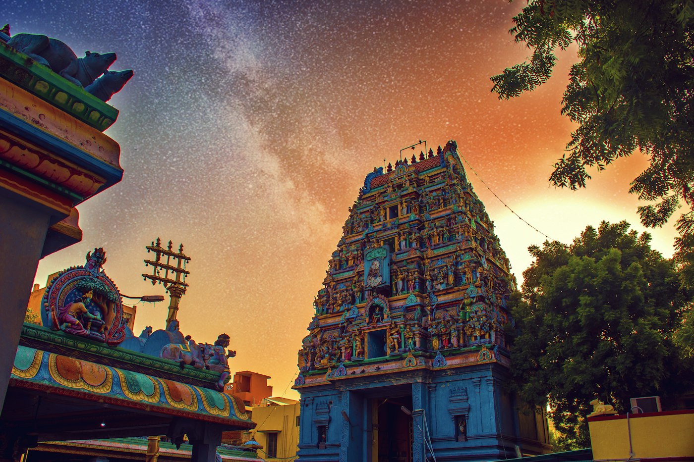 A carved temple tower in Tamil Nadu at dusk