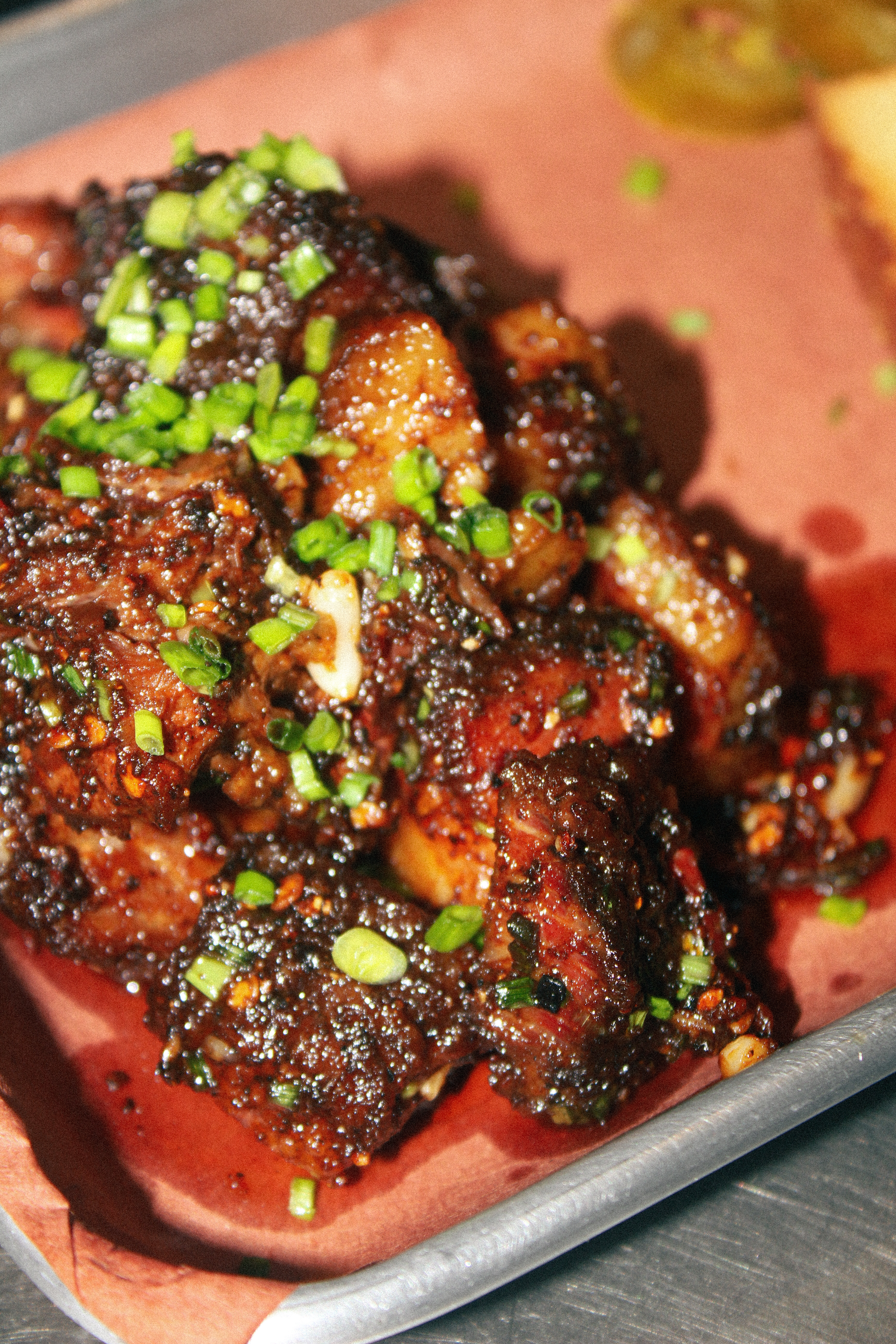 Glazed smoked beef with chives on butcher paper