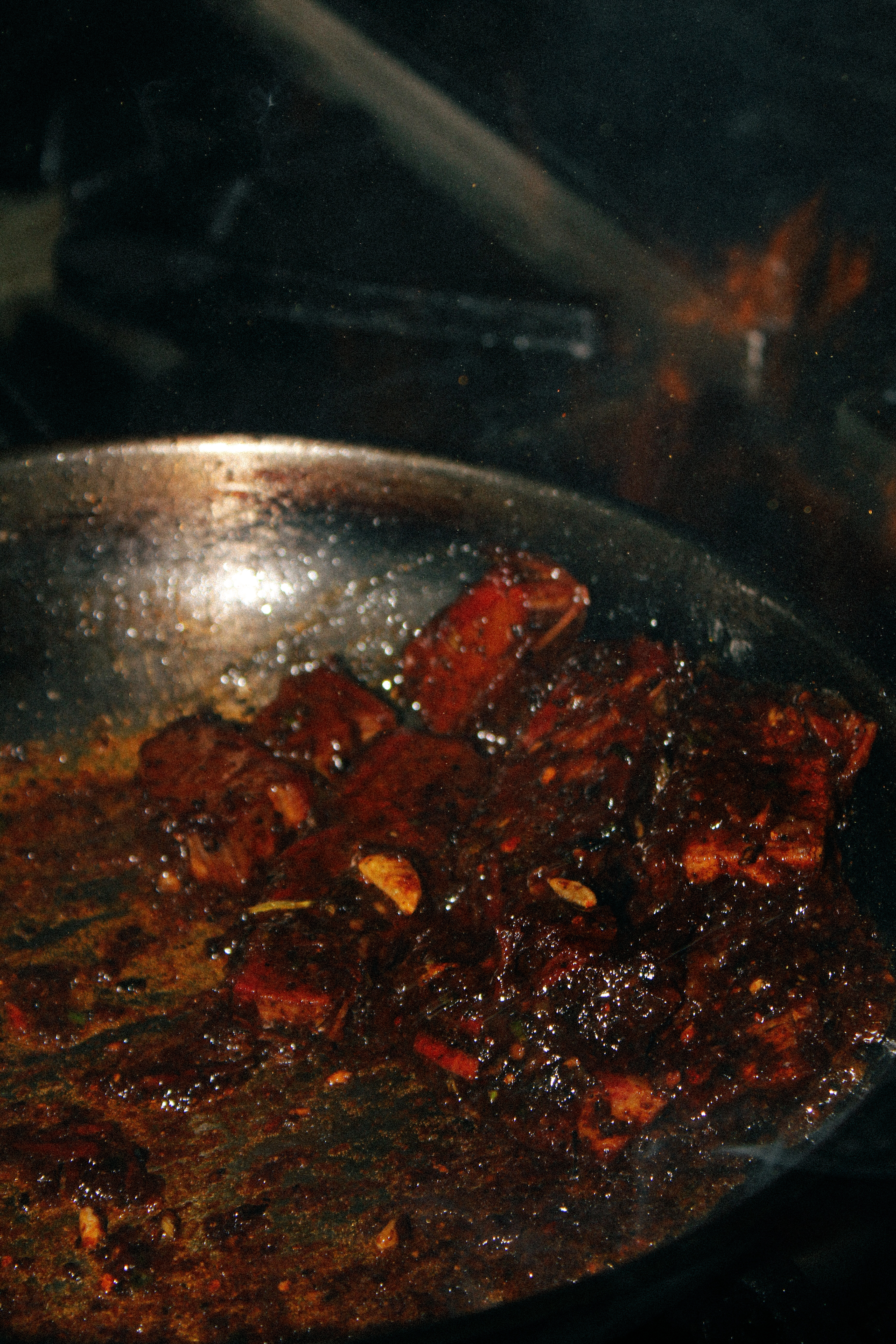 Smoked meat glazing in a pan on the stove
